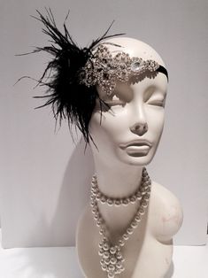 Black & Silver Feather Headpiece- Gatsby Wedding- Feather 20's Head Wrap- 1920 Hair Accessory- Speakeasy- Handmade in USA- Charleston Hair Accessory- Gatsby Style. Hello, This black feather fascinator head wrap is made with ostrich feathers. The rhinestone piece measures about 4 inches long by 2 inches and the feathers are 6-8inches. They are placed on a stretch band that fits any adult head size and very comfortable. Other Feather Colors available in: white ivory pink orange fuschia red cor Black Gatsby Style Wedding Headpiece, Elegant Feathered Headpiece For Vintage Events, Black Gatsby Style Fascinator, Vintage Fitted Headpieces For Party, Vintage Black Headpieces For Costume Party, Vintage Black Headpieces For Parties, Vintage Wedding Fascinator With Feathers, Vintage Black Fascinator For Costume Party, Black Flapper Headpieces For Party