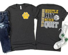 two t - shirts that say hustle but never quit out with a paw print on the front