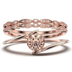 a rose gold wedding ring set with a round diamond in the center and two matching bands