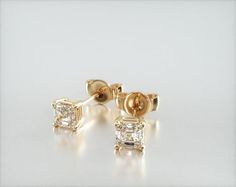 14K Yellow Gold Asscher Cut Lab Grown Diamond Stud Earrings (0.25 CTW - F-G / VS2-SI1). This pair of classic, asscher shape lab created diamond earrings feature a tapered basket that showcases the unique characteristics of an asscher shape lab created diamond. The bold flashes of light and a luminescent nature capture the eye with every move. Asscher Cut Diamond, Jewelry Accessories Ideas, Unique Characteristics, Asscher Cut, Accessories Ideas, Diamond Stud Earrings, Diamond Stud, Lab Created Diamonds, Diamond Earrings Studs