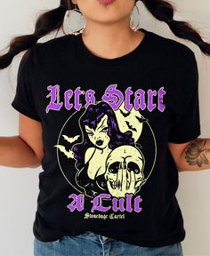 Looking to start a cult? Look no further! This goth, spooky unisex tee is perfect for all of your charismatic recruitment needs. Get ready to spread your message and attract loyal followers with this quirky and playful t-shirt. (Warning: may cause sudden popularity and/or controversy.) . Let's Start a Cult . 100% combed ringspun cotton· Light fabric· Premium fit· Runs bigger than usual· Original design Care Instructions: Machine wash cold. Do not bleach. Tumble dry low. Alternative Halloween T-shirt With Text Print, Punk Halloween T-shirt With Text Print, Emo Halloween Concert T-shirt, Punk Halloween Text Print T-shirt, Gothic Halloween Concert T-shirt, Edgy Halloween T-shirt With Text Print, Edgy Halloween Fan Merchandise T-shirt, Pre-shrunk T-shirt For Halloween Alternative Fashion, Your Message