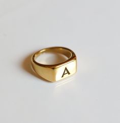 Elevate your everyday style with our Personalized Letter Ring, a timeless piece of jewelry that adds a personal touch to any outfit. This custom initial ring is thoughtfully designed to be both elegant and meaningful, making it the perfect gift for yourself or a loved one. Key Features: Customization: Choose any letter to represent your name, a loved one, or a meaningful word. Each ring is handcrafted with precision to ensure your chosen initial stands out beautifully. Premium Materials: Availab Personalized Gold Rings, Name Ring, Letter Ring, Name Rings, Initial Ring, Custom Initials, Custom Rings, Everyday Style, Custom Engraving