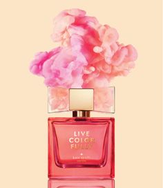 a bottle of perfume with pink flowers in it on a yellow and pink background that says live color fully