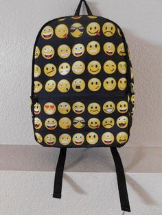 "Black backpack with comical facial expressions Two side pockets Small top zipper pocket One large elastic open interior compartment One exterior zipper compartment Adjustable straps Signs of normal use but condition is great Dimension - height 16.5\" length 11.5\" depth 5.5\"" Novelty Backpack For Everyday Use, Novelty Black Backpack For Everyday Use, Fun Travel Backpack With Zipper Closure, Novelty Black Backpack, Fun Black Standard Backpack, Novelty Black Standard Backpack, Black Novelty Standard Backpack, Fun Black Bags For Back To School, Embroidered Backpack