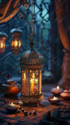 an ornate lantern with candles lit in front of it on a table surrounded by other decorations