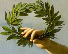 a painting of two hands holding green leaves