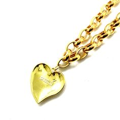 CC Irregular Heart Necklace - Golden Stainless Steel chain with golden metal and enamel pendant - white or black - 30mm Vintage Reworked CC Pendant - Textured Logo in the front and original banner in the back with designer signature - Vintage pieces can show signs of wear or handmade adjustments made to fit jewelry design purpose. - Length: 18" The Re-Works Artisan Piece Collection offers authentic reworked and repurposed jewelry made from pre-owned/second hand or replacement pieces left in fact Heart-shaped Gold Enamel Necklace, Gold Heart-shaped Enamel Necklace, Vintage Metal Chain Necklace With Heart Pendant, Vintage Metal Heart Pendant Chain Necklace, Vintage Gold Heart Metal Necklace, Vintage Heart Pendant Chain Necklace For Valentine's Day, Yellow Gold Metal Heart Pendant Chain Necklace, Heart Pendant Gold Chain Jewelry, Gold Chain Heart Pendant Jewelry