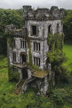 an old abandoned building with ivy growing on it