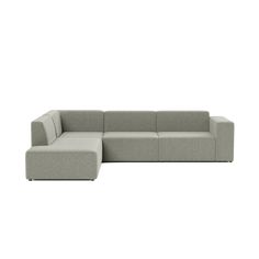 a gray sectional couch sitting on top of a white floor