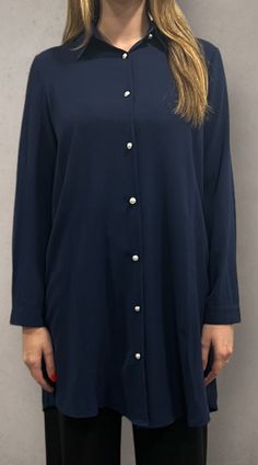 Modest v-neckline with collar. Pearl button down front. Buttoned sleeves. Fall V-neck Blouse With Buttons, Fall V-neck Shirt With Button Closure, Elegant V-neck Shirt With Back Button Closure, Formal V-neck Shirt With Button Closure, Formal V-neck Shirt With Buttons, Fall V-neck Blouse With Placket, V-neck Buttoned Blouse For Fall, Long Sleeve Tops With Pearl Buttons For Work, Long Sleeve Work Tops With Pearl Buttons