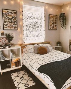 a bed room with a neatly made bed and lots of lights on the wall above it