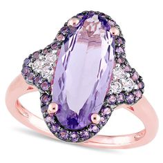 This stunning gemstone ring is sure to catch the eye. Crafted from high-quality sterling silver with rose rhodium plate, its dazzling design features a striking 16.0 x 7.0mm oval-shaped amethyst in bright purple, flanked on either side by trios of shimmering white topaz. The central gemstone is surrounded by a delicate frame of smaller amethyst gems, creating a truly dynamic and luxurious look. With its bold and unique design, this ring is the perfect accessory for any occasion. Please note that as a custom-made item, this ring cannot be resized after purchase.The perfect complement to any elegant style, this ring will be hand-made exclusively to your order by our skilled jewelers. Please allow 7-9 business days for processing.Product ID: GLD-TA-133138Precious Metal Type: Rose Sterling Sil Amethyst Cocktail Ring, Elongated Oval, Ring Purple, Glamorous Style, Bright Purple, Fabulous Jewelry, Black Rhodium, Topaz Gemstone, Amethyst Gemstone