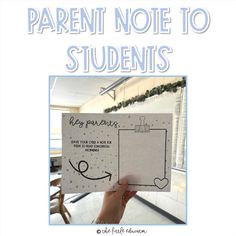 a person holding up a piece of paper with the words, parent note to students