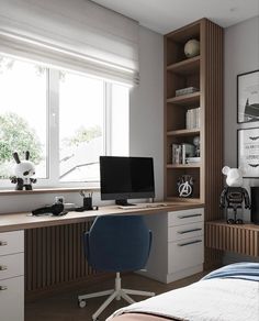 a bedroom with a bed, desk and computer on the dresser in front of a window