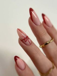 22 Trendy Red French Tip Nails to Keep Your Winter Look Fresh | Everygirl Edit French Tip Nails Gel Almond, Red Winter Nails Almond, Christmas Nails Aesthetic Red, Winter Nail Almond, Christmas Nails Red Almond, Red Christmas Nail Designs 2024, Red Nail French Tips, French Tip Xmas Nails, French Red Tip Nails