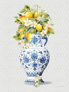 a blue and white vase with lemons and flowers in it on a gray background