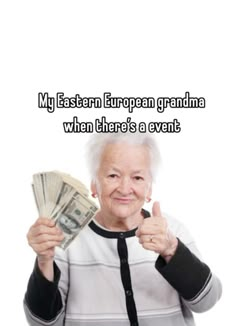 an elderly woman holding up money and giving the thumbs up