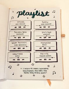 an open notebook with music notes on the page and playlist written in cursive writing