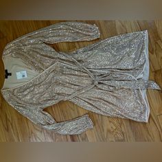 Forever 21+ - A Knit Wrap Dress Featuring Metallic Sequins, A Surplice Neckline, Long Sleeves, Knee Length, And A Tulip Hem. Content + Care - Shell: 95% Polyester, 5% Spandex - Other Contents: 100% Polyester - Hand Wash Cold Size + Fit - Model Is 5'8" And Wearing A Size 1x Forever 21 Long Sleeve Dresses For Party, Forever 21 Long Sleeve Party Dress, Forever 21 Fall Party Dress, Bodycon Shirt, Sequin Wrap Dress, Grey Long Sleeve Dress, Ruffle Wrap Dress, Knit Wrap Dress, Shimmer Dress