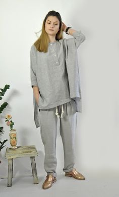 "Gray Linen Shirt, Linen Tunic Shirt, Linen Clothing Linen Top. Woman exstravgant Loose Shirt. Handmade linen shirt. Beautiful and comfortable. Linen Summer Blouse. Comfortable top. Excellent style for a spring and summer seasons. ◾Quality NATURAL linen fabric. Color : Gray Model wearring size S. ◾ The style was originally designed and professionally constructed by me. Each item of my shop is specially packaged with a lot of concern! Handmade in a pet-free and smoke-free environment Every piece Casual Tunic Top For Loungewear, Oversized Buttoned Tops For Loungewear, Gray Relaxed Fit Cotton Blouse, Casual Gray Tops For Daywear, Relaxed Fit Tunic Top With Buttons, Relaxed Fit Top With Buttons For Loungewear, Gray Relaxed Fit Tops For Daywear, Loose Linen Shirt, Linen Tunic Shirt