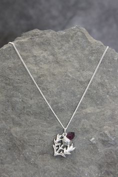 This Thistle necklace is truly gorgeous - I just hope the photos does it justice. They have been beautifully sculpted and are 3D in appearance.  They are hand cast from the finest Scottish pewter and the flower head is an inset glass amethyst.  Perfect for anyone looking for Scottish jewelry or something with an Outlander theme.  Supplied on a fine silver plaited chain with extender chain. Available in a choice of chain length.  Both the chain and pewter thistle are lead and nickel free.  Matchi Scottish Crown Jewels, Scottish Earrings, Scottish Jewellery Vintage, Scottish Thistle Necklace, Scottish Jewelry, Thistle Necklace, Amethyst Flower, Scottish Jewellery, Scottish Thistle