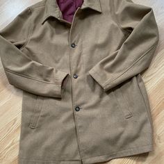 Polyester, Wool And Acrylic. Size L Never Worn, Lined And Has Two Front Pockets Casual Wool Coat With Buttons And Long Sleeves, Brown Collared Outerwear With Button Cuffs, Brown Collared Outerwear With Button Closure, Casual Wool Coat With Lapel Collar And Buttons, Brown Wool Outerwear With Button Cuffs, Tailored Brown Outerwear With Hidden Button Closure, Brown Collared Outerwear With Buttons, Brown Tailored Outerwear With Hidden Button Closure, Classic Long Sleeve Outerwear With Buttons