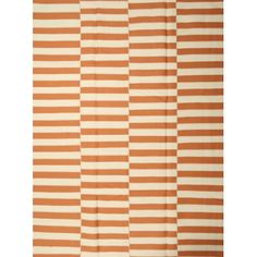 an orange and white striped rug with vertical stripes