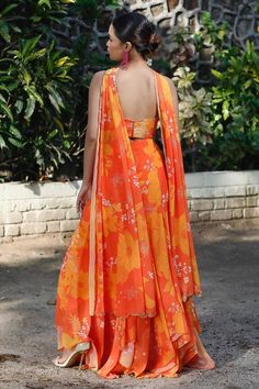 Yellow and orange high low skirt with floral print. Paired with a tube padded blouse and matching scallop embroidered sleek dupatta. - Aza Fashions Sleeveless Orange Set For Festive Occasion, Orange Sleeveless Festive Set, Festive Orange Sleeveless Sets, Summer Wedding Orange Sets, Festive Orange Floral Print Sets, Orange Sleeveless Dress For Festive Occasions, Orange Sleeveless Festive Dress, Festive Floral Print Orange Dress, Festive Orange Floral Print Dress