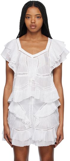 Semi-sheer cotton voile blouse. Lace detailing throughout. · Modified square neck · Pleats at front and back · Tiered ruffles at armscyes Supplier color: White Square Neck Ruffle Blouse For Daywear, Square Neck Ruffle Tops For Daywear, Square Neck Cotton Tops With Ruffles, Ruffled Square Neck Blouse, Feminine Square Neck Top With Ruffles, Chic Square Neck Blouse With Ruffles, Elegant Square Neck Top With Ruffles, Etoile Isabel Marant, Blouse Lace