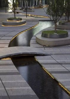 the water is running down the sidewalk in the city