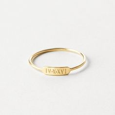 "A minimal, dainty ring that says so much! Personalize your bar ring with initials, names, dates or symbols or leave it blank. Made to last using high-quality materials and authentic hand-stamped personalization so you'll cherish it for years to come.  Every piece is handcrafted and hand-personalized with love in La Conner, WA, using 90% recycled and 100% ethically sourced raw materials from the USA--because it's better that way. Includes free gift-ready packaging (featuring a care card and traditional letterpress goodies made by my dad)!  MATERIALS: * Gold = 14k gold filled * Silver = sterling silver * Rose gold = 14k rose gold filled DETAILS: * 9x2.8mm bar * Hand-personalized with traditional metal punches AT CHECKOUT: * If you chose \"other\" for size, specify which ring size you'd like Date Engraved Ring, Ring Stamping Ideas, Minimalist Stackable Initial Ring For Anniversary, Minimalist Engraved Ring With Initials For Anniversary, Minimalist Engraved Yellow Gold Midi Rings, Minimalist Stackable Wedding Rings With Initials, Minimalist Initial Ring With Engraving Option For Wedding, Minimalist Stackable Rings With Initials For Anniversary, Minimalist Wedding Initial Ring With Engraving Option