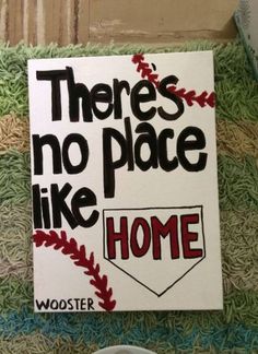 there's no place like home sign on the door way to a baseball field