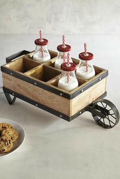 a wooden box filled with milk and cookies