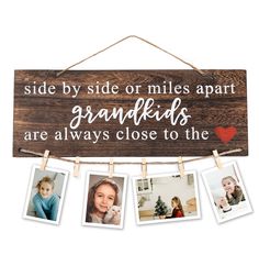 a wooden sign that says, side by side or miles apart grandkids are always close to the heart