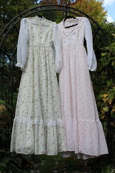 Cottage Divine is downsizing our massive collection of original vintage prairie clothing, and we're pleased to offer this vintage 2 piece clothing lot for sale. Both are branded Gunne Sax, tagged vtg Junior Size 9. All would be considered XS/S by today's sizing standards. These are original vintage pieces, not fast fashion repros, so you should expect attributes like: small repairs needed, fabric fade & wear, age spots, loose buttons, zippers, or trim, storage scents, etc. You will receive: * (1) Gunne Sax Victorian style maxi prairie gown in a graceful floral print with lace bodice and long sash tie. Semi sheer fabric over acetate lining. Billowy sheer sleeves. Some snags/light dot mark to sheer sleeve. * (1) Gunne Sax light pink rose corset style long length dress. Also semi sheer fabric Gunne Sax Wedding Dress, Rose Corset, Boho Gown, Long Length Dresses, Sax Dress, Gunne Sax Dress, Light Pink Rose, Gunne Sax, Prairie Dress