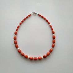 < Coral pearl necklace > This product made according to the model of authentic traditional Ukrainian jewelry. The coral is modern, the design is vintage. Like 99% of the coral on the market these days, this coral has been dyed. I use bamboo coral which is not endangered or threatened in any way, unlike natural pink or red coral (the production of which is forbidden almost everywhere in the world). Bamboo coral doesn't mean it's not organic. Every bead of it has a distinctive and beautiful Handmade Red Coral Beads For Jewelry Making, Handmade Red Coral Jewelry With Oval Beads, Handmade Red Coral Oval Beads Jewelry, Handmade Oval Beads Red Coral Jewelry, Artisan Red Coral Beads For Gifts, Artisan Red Coral Beads Gift, Orange Hand-strung Jewelry With Round Beads, Hand-strung Orange Jewelry With Round Beads, Orange Oval Beaded Necklace For Gifting