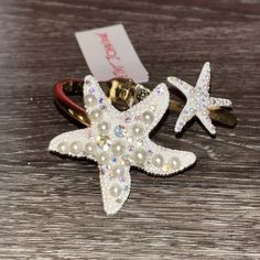 Beautiful Bracelet From Betsey Johnson. Gold Tone Band With Sparkling White Starfish On Them. Starfish Have Rhinestones And Sparkle. Both Glamorous And Whimsical. Great For Summer Beach Looks. Starfish Charm Jewelry For Parties, Ocean-inspired White Star Jewelry, Party Jewelry Starfish Charm, Adjustable White Jewelry With Starfish Charm, Starfish Charm Party Jewelry, Ocean-inspired White Star-shaped Jewelry, White Star-shaped Ocean-inspired Jewelry, White Starfish Beach Jewelry, Ocean-inspired White Jewelry With Starfish Charm