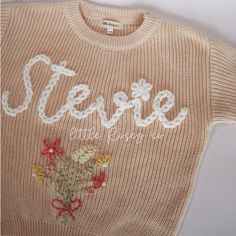 MAKE SURE YOU FILL OUT ALL PERSONALIZATION QUESTIONS :) Fully custom personalized hand embroidered sweaters. These NAME SWEATERS are great for any occasion, but they are perfect for birth announcements, milestone photos, family pictures, birthdays, and other family gatherings. They are also perfect for baby shower gifts, baby gifts, and toddler gifts.  Limit of flowers in single bouquet is 8. The sweaters run from size 0-3 through 5t and are meant to be an oversized look. Turn around time is subject to change and is based on what color and size sweater you order.  Every sweater is hand embroidered and can vary from sweater to sweater depending on the size of sweater and length of name/word. Names that are 5 letters or less are best for our chunky yarn while names that have more than 5 lett Word Names, Single Bouquet, Embroidered Sweaters, Milestone Photos, Milestone Pictures, Big Sis, Floral Sweater, Gifts Baby, Gender Neutral Baby Clothes