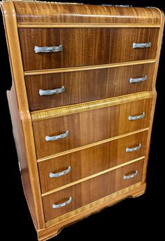 an old wooden dresser with metal handles