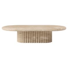 an oval table made out of wood with pleated edges and a circular base, on a white background