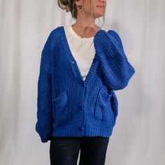 Get ready to cozy up with our Chunky Sweater Cardigan! This royal blue beauty is not only oversized and chunky knit, but it also features a convenient button up design. Perfect for bundling up and adding a pop of color to your outfit. (Go ahead, make a statement!) Also, perfect for gamedays if your team color is blue! Fabric: 100% acrylic I am wearing the size large - This cardigan is fitting oversized. If you are between sizes, you could size down. Stats: height: 5'7 - bust: 37 - waist: 34 - hi Wedding Guest Accessories, Faith Based Gifts, Chunky Sweater Cardigan, Wedding Journal, Maxi Jumpsuit, Pregnancy Journal, Blue Beauty, Book Corners, Sweater Tank Top