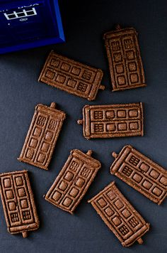 chocolate cookies shaped like the tardishes from doctor who are sitting on a table