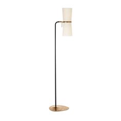 a floor lamp with a white shade on it