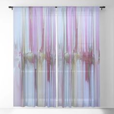 an abstract painting with pink, blue and yellow colors on the curtain in front of a white wall