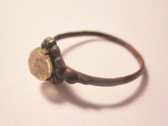 Here is a real treasure, an authentic late Medieval bronze fully original and unrestored bronze ring in size 8.75  found in Northern Europe/Eastern Baltic from the time of the late Medieval  This piece of history is very stable and can be worn with reasonable care.  I have left this as found for the purist, but should you wish to clean it simply leave in lemon juice, wipe gently and dip in olive oil and again wipe.  It will self clean with normal ware.  It is dated between 1400-1700 AD.    I am offering this ring with a Certificate of Authenticity and lifetime money back guarantee of authenticity. Medieval Ring, Medieval Rings, Bronze Ring, Northern Europe, Clear Stone, Leave In, Lemon Juice, Olive Oil, Favorite Jewelry