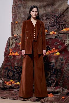 Channeling a classic sensibility, our seasonal vest is tailored to a classic suiting silhouette in new Stretch Corduroy. Signature golden buttons impart an elevated finish, while the sumptuous cognac hue has a smart and ageless quality. Classic and timeless, Rosetta Getty features Stretch Corduroy for the Fall 23 season. Designed with a bit of stretch for ease of wear, this fabrication has a soft yet durable hand that is ideal for softly tailored silhouettes. V-neck Sleeveless Button front Chest Brown Suits With Buttons For Work, Brown Workwear Suits With Buttons, Elegant Brown Notch Lapel Vest, Elegant Brown Vest With Notch Lapel, Brown Double Breasted Suit For Formal Occasions In Fall, Brown Double-breasted Suit For Fall, Brown Double-breasted Fall Suit, Brown Double Breasted Suit For Fall Workwear, Brown Double-breasted Suit With Buttons