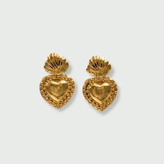 Our Sacred Heart Earrings have all the details, featuring a bold, line-engraved heart diffusing flames and divine rays of light. These beauties are lightweight and make a perfect addition to any jewelry collector. The Sacred Heart is popular throughout Mexico. It signifies the higher power of divine love for humanity. Details: 14k Gold-Filled Height: 3 cm / 30 mm Width 2 cm / 20 mm Hypoallergenic, Nickle Free, and Lead-Free Sacred Heart Earrings, Sacred Heart Necklace, Gold Brass Heart Earrings Pierced, Sacred Heart Pendant, Sacred Heart Jewelry Necklaces, Heart Studs, Heart Earrings Studs, Sacred Heart, Higher Power