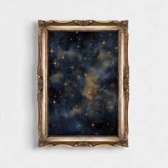 an ornate gold frame holds a painting of stars in the night sky, against a white wall