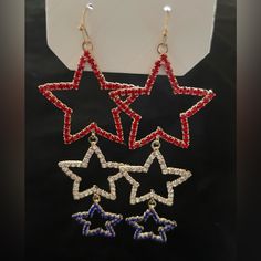 Red, White And Blue Dangling Stars Earrings. Gold Tone. Brand- Juliet By Crystal Avenue. Patriotic Red Star-shaped Earrings, Blue Star Charm Earrings For Party, Adjustable Red Patriotic Earrings, Red Star-shaped Jewelry For Parties, Multicolor Star Earrings For Parties, Multicolor Star-shaped Party Earrings, Red Dangle Earrings For 4th Of July, Red Dangle Jewelry For 4th Of July, Red Star-shaped Party Jewelry