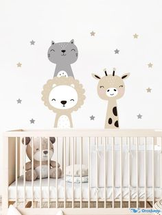 a baby crib with two animals and stars on the wall